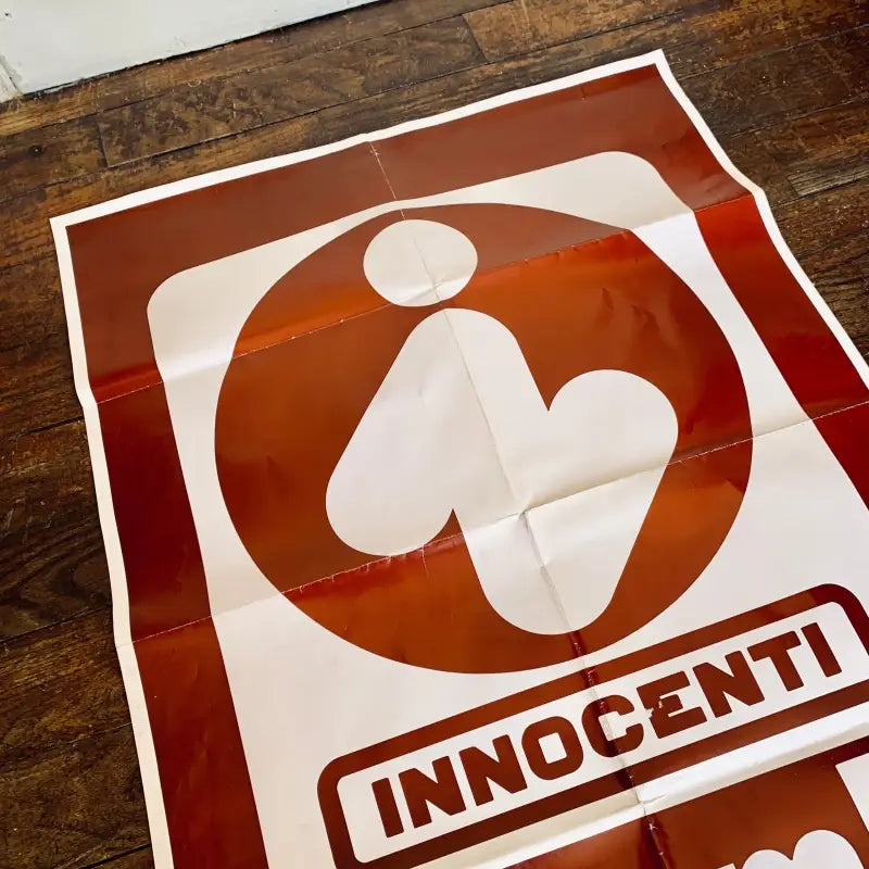 Logo dell’azienda Innocenti con figura umana stilizzata.