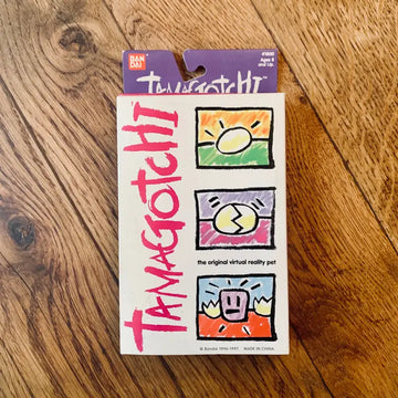 Pacchetto di gioco per animali domestici virtuali Tamagotchi con icone colorate dei cartoni animati.